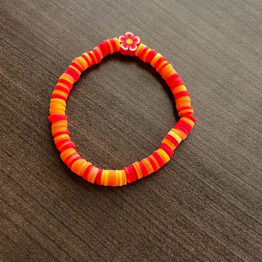 Multi colored orange flower clay beaded bracelet